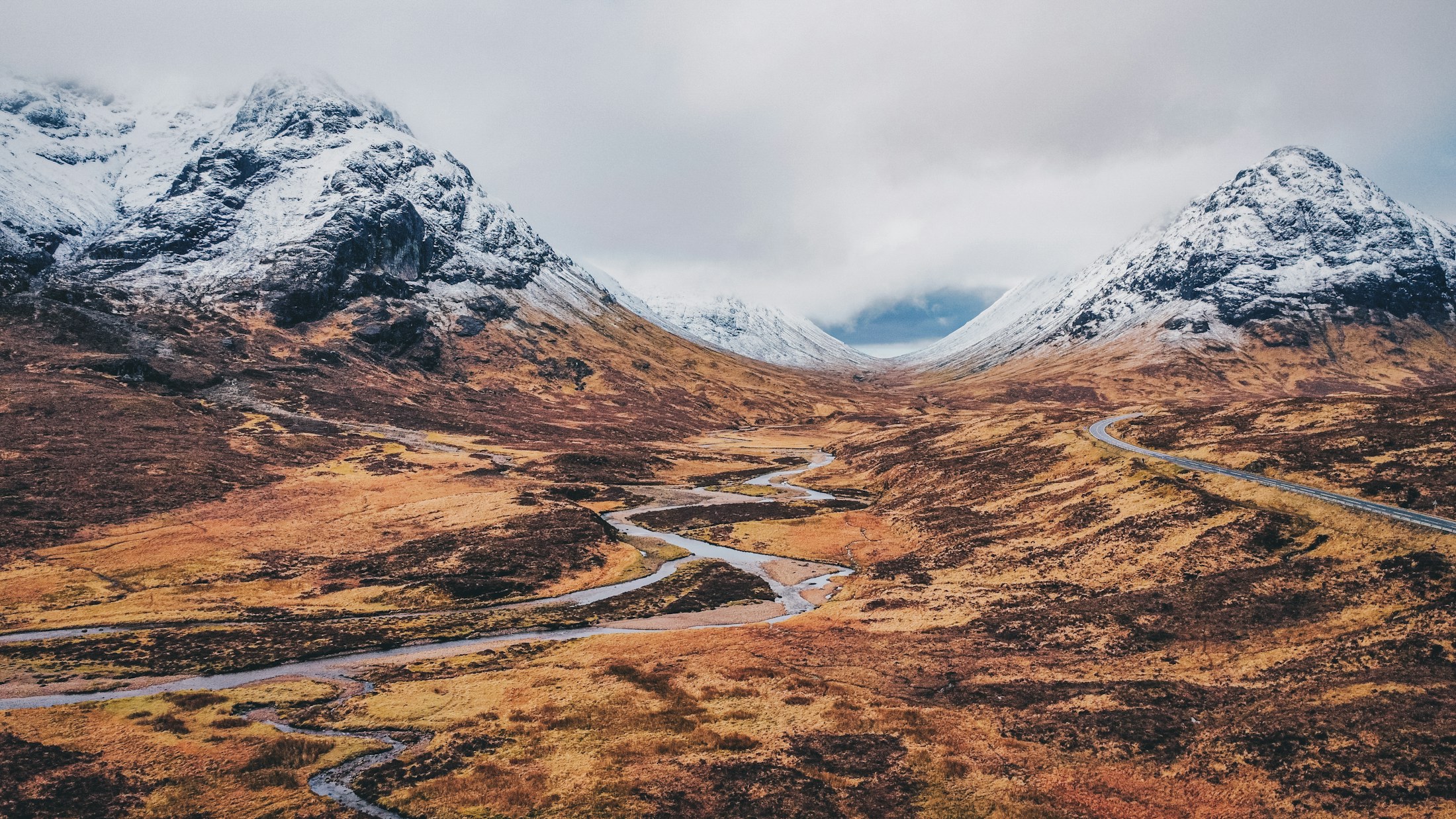 A road winding through the mountains of Glencoe