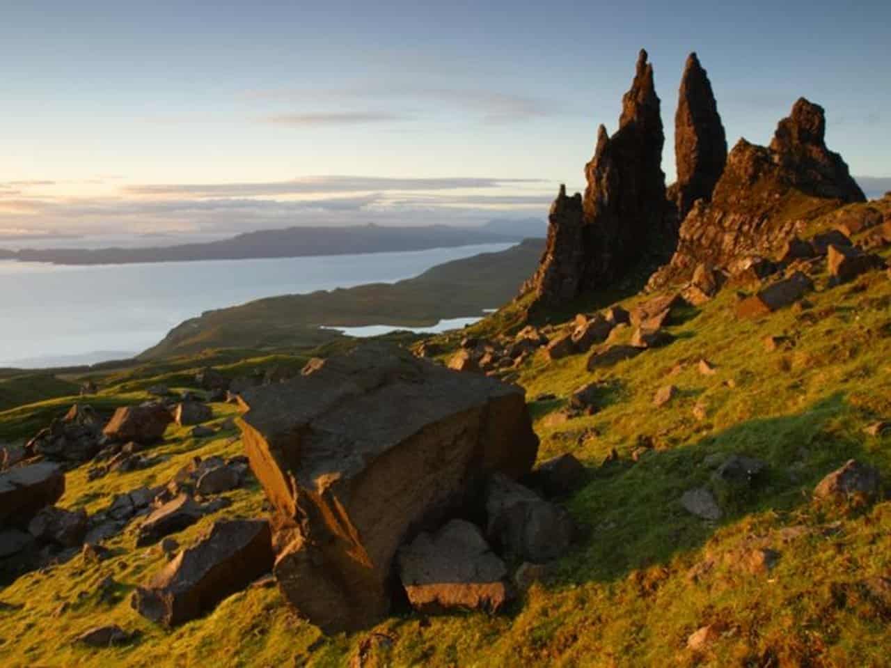 Calm Highland water beneath green mountain slopes
